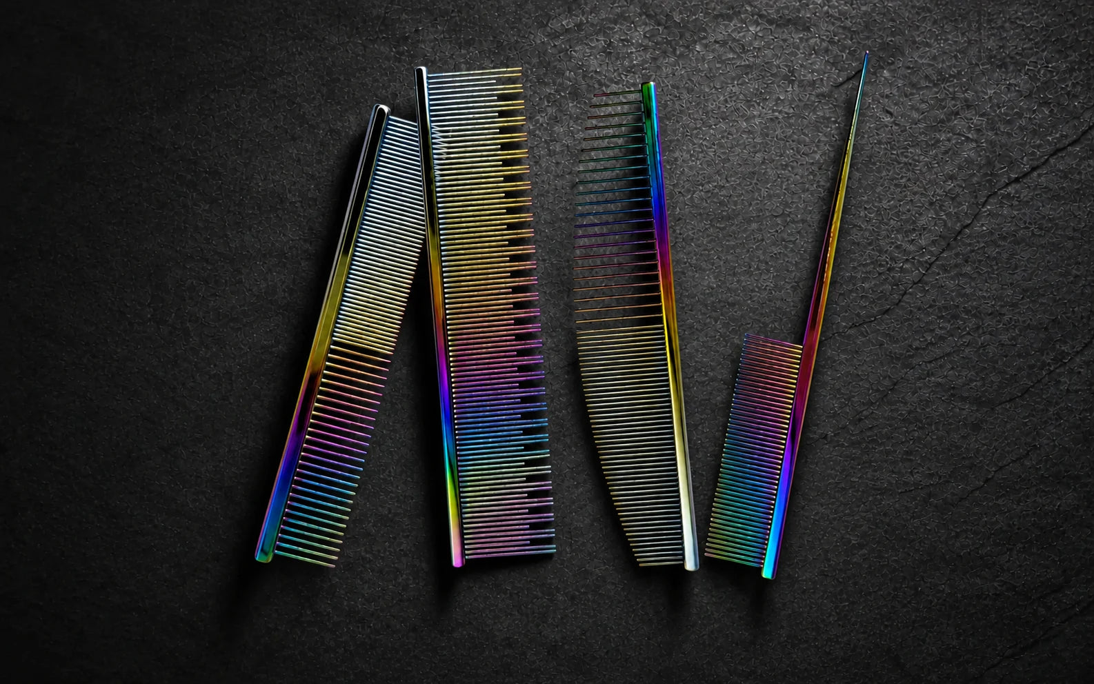 Four VUNRO rainbow grooming combs with different tooth spacing